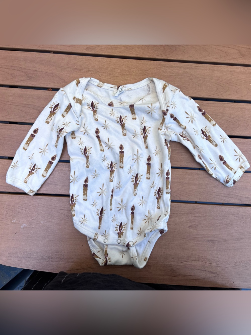 kate quinn holiday candle Print onesie